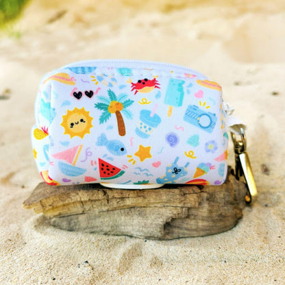 Back view of our Summer Bliss dog poop bag holder showing the zipper closure and sturdy clip that easily attaches to a D-ring on your lead or  handbag. Lightweight neoprene design with a baby blue base and beach-inspired pattern, designed in Australia by Pet Store Collective.